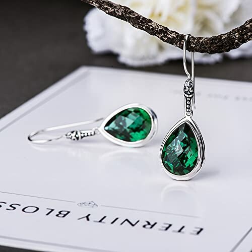 Elegant green gemstone earrings on display.